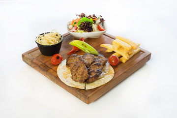 Grilled meatballs with appetizers. Traditional turkish kofte.