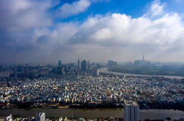 Early Morning Panorama of Ho Chi Minh City Vietnam. Often there is low cloud and mist in the morning at this time of the year. Photo taken from District 7 looking toward the City and Saigon River