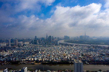 Early Morning Panorama of Ho Chi Minh City Vietnam. Often there is low cloud and mist in the morning at this time of the year. Photo taken from District 7 looking toward the City and Saigon River