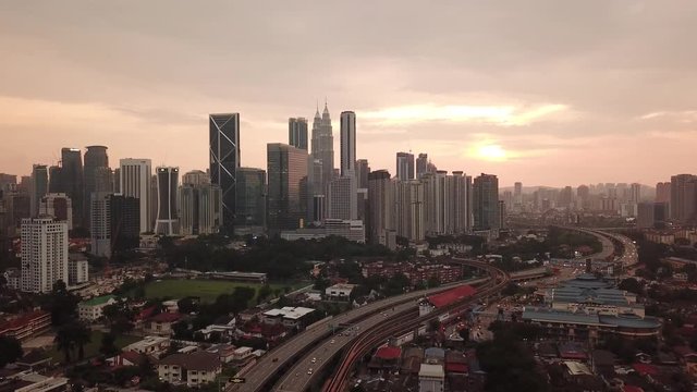 Kuala Lumpur, Malaysia - 1 July 2019: Aerial view of Kuala Lumpur city in Malaysia capital, tall buildings. Cinematic video of skyscrapers in big City.