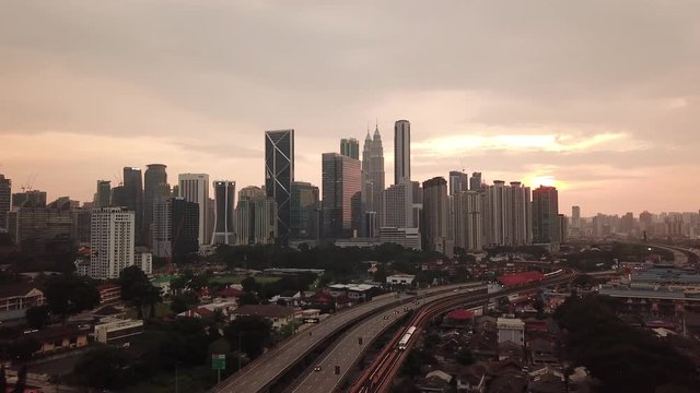 Kuala Lumpur, Malaysia - 1 July 2019: Aerial view of Kuala Lumpur city in Malaysia capital, tall buildings. Cinematic video of skyscrapers in big City.