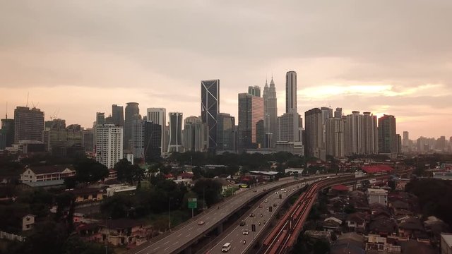 Kuala Lumpur, Malaysia - 1 July 2019: Aerial view of Kuala Lumpur city in Malaysia capital, tall buildings. Cinematic video of skyscrapers in big City.
