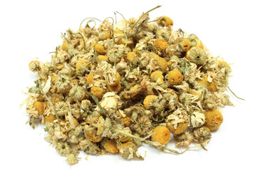 Dried chamomile on white background. Alternative medicine concept