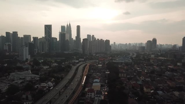 Kuala Lumpur, Malaysia - 1 July 2019: Aerial view of Kuala Lumpur city in Malaysia capital, tall buildings. Cinematic video of skyscrapers in big City.