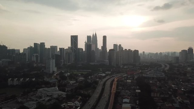 Kuala Lumpur, Malaysia - 1 July 2019: Aerial view of Kuala Lumpur city in Malaysia capital, tall buildings. Cinematic video of skyscrapers in big City.