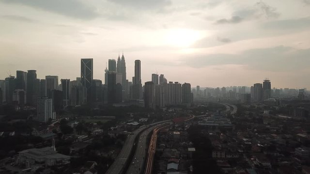 Kuala Lumpur, Malaysia - 1 July 2019: Aerial view of Kuala Lumpur city in Malaysia capital, tall buildings. Cinematic video of skyscrapers in big City.