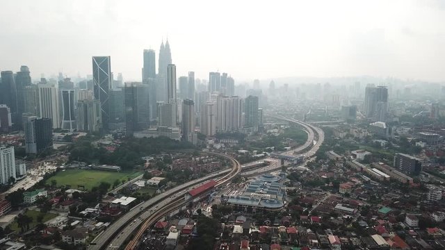 Kuala Lumpur, Malaysia - 1 July 2019: Aerial view of Kuala Lumpur city in Malaysia capital, tall buildings. Cinematic video of skyscrapers in big City.