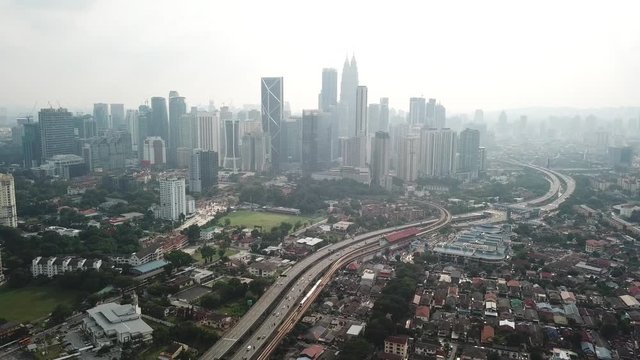 Kuala Lumpur, Malaysia - 1 July 2019: Aerial view of Kuala Lumpur city in Malaysia capital, tall buildings. Cinematic video of skyscrapers in big City.
