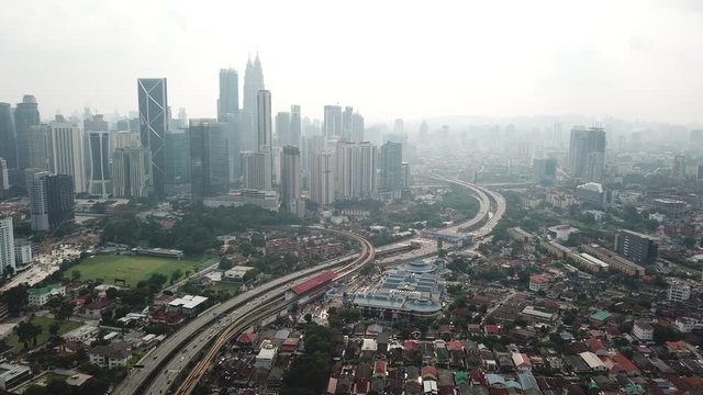 Kuala Lumpur, Malaysia - 1 July 2019: Aerial view of Kuala Lumpur city in Malaysia capital, tall buildings. Cinematic video of skyscrapers in big City.