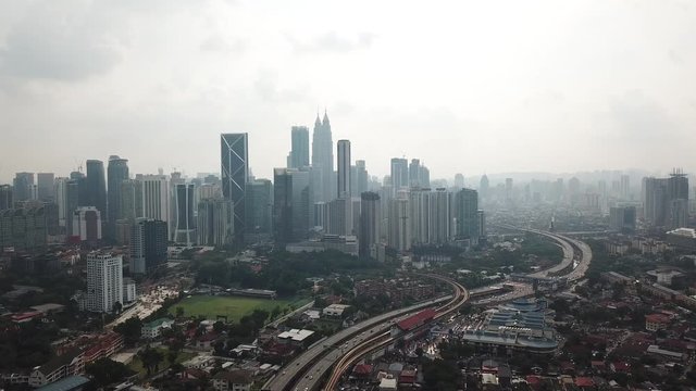 Kuala Lumpur, Malaysia - 1 July 2019: Aerial view of Kuala Lumpur city in Malaysia capital, tall buildings. Cinematic video of skyscrapers in big City.