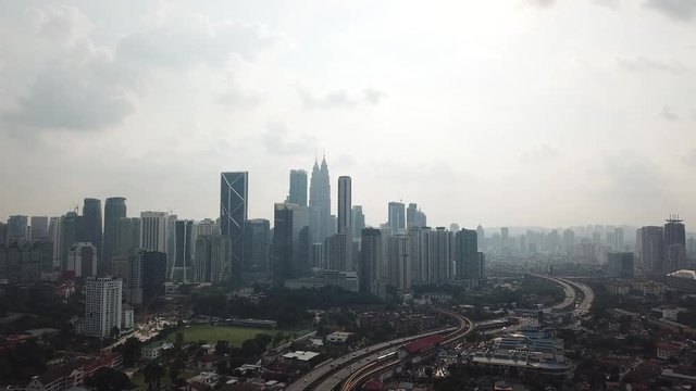 Kuala Lumpur, Malaysia - 1 July 2019: Aerial view of Kuala Lumpur city in Malaysia capital, tall buildings. Cinematic video of skyscrapers in big City.