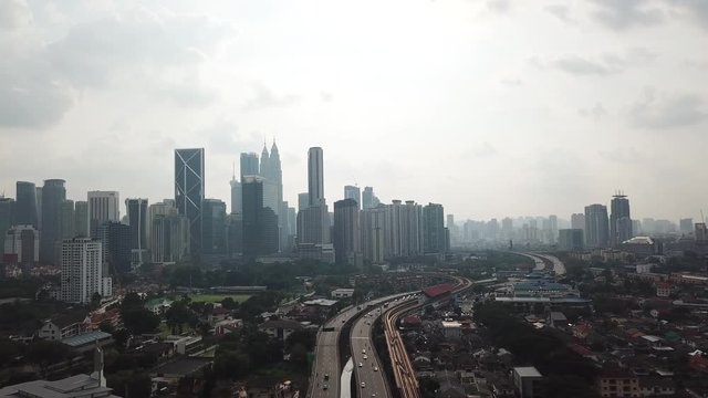 Kuala Lumpur, Malaysia - 1 July 2019: Aerial view of Kuala Lumpur city in Malaysia capital, tall buildings. Cinematic video of skyscrapers in big City.