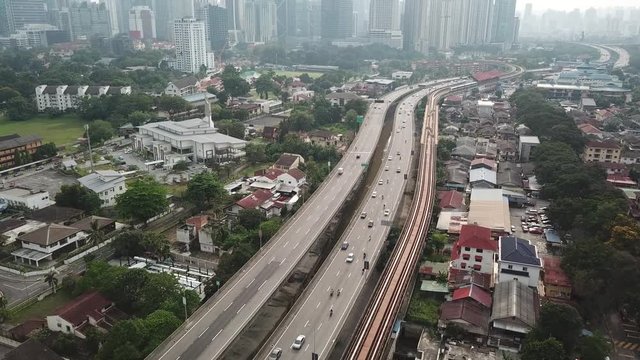 Kuala Lumpur, Malaysia - 1 July 2019: Aerial view of Kuala Lumpur city in Malaysia capital, tall buildings. Cinematic video of skyscrapers in big City.
