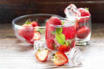 fresh Strawberry mojto cocktail with ice and mint in glass fruit to make water in the summer.