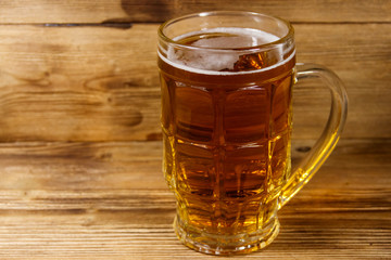 Mug of beer on a wooden table