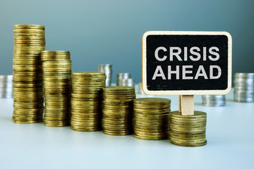 Crisis ahead concept. Financial chart from coins.