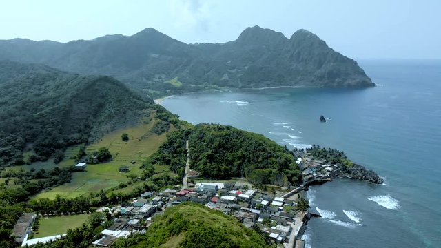 An aerial view of a small town near the sea in Sabtang, Batanes.