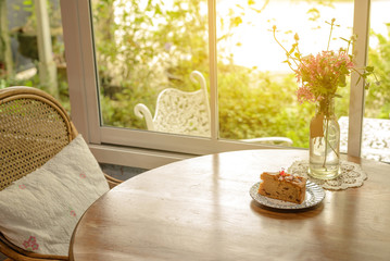 Piece of homemade taro cake in classic plate on table with copy space for text