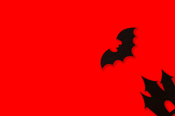 Halloween holiday decorations on red background, Flat lay of Halloween decorations on red, top view copy space, Halloween concept.