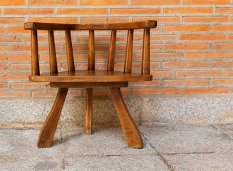 Chair against the background of brick wall