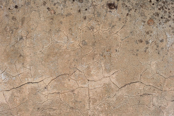 Texture of a concrete wall with cracks and scratches which can be used as a background