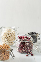 Raw grain bean in a glass jar in home kitchen. Source of protein for vegetarian