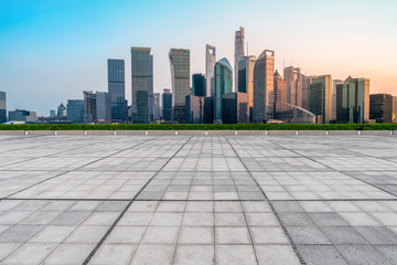 Urban skyscrapers with empty square floor tiles
