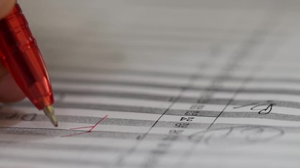 Hand of teacher using red pen write grade F and circle on test score and grading. Concept of measurement and evaluation.