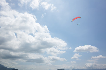 colorful paragliding over blue sky