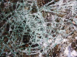 The broken glass of the car. Texture. Background.