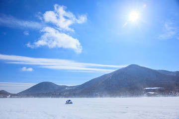 冬の赤城山の氷結した大沼でワカサギ釣り風景　群馬県前橋市