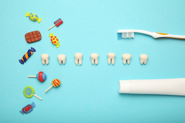 Teeth with sweet candies. Tooth caries in children's, dental healthcare, toothpaste and toothbrush.