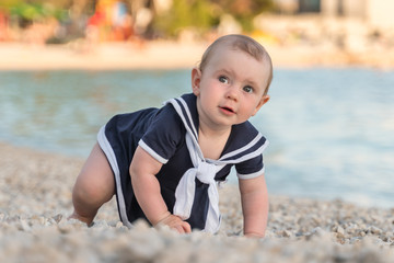 Cute little baby girl on the beach