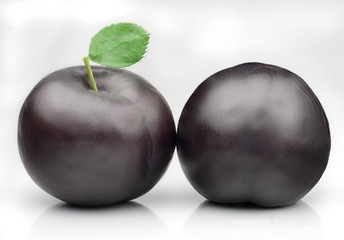 Fresh plums isolated on white