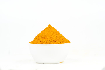 Turmeric powder isolated on a white background