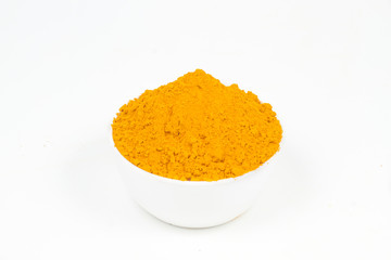 Turmeric powder isolated on a white background