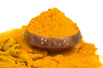 Turmeric powder isolated on a white background