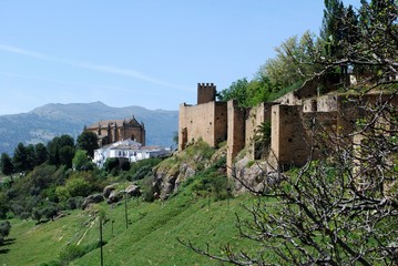 View along the old town wall towards the The Holy Ghost church, Ronda, Spain.