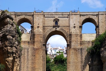 Fototapeta na wymiar View of the top part of the new bridge with town buildings to the rear, Ronda, Spain.