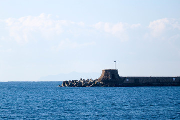View to a pier of Livorno port, Italy on Ligurian sea