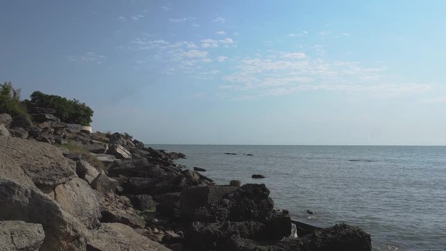 Sea and rocky stones on seashore. Sea and rock.