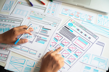 Website designer Creative planning application developer development draft sketch drawing template layout prototype framework wireframe design studio . User experience concept .