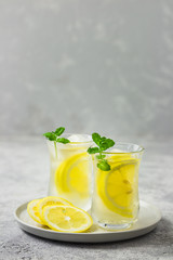 Iced lemon mint tea with ginger and honey. Selective focus, space for text.