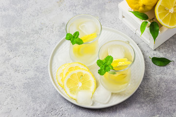 Healthy honey and mint lemon iced detox water. Selective focus, space for text.