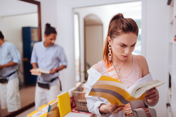 Serious student staring at interesting scientific article