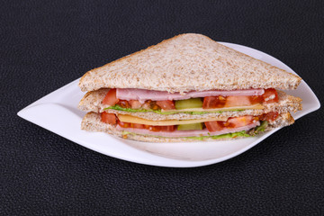 Club sandwich with ham and cheese