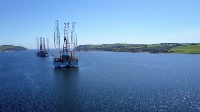 Drone Passing An Oil Rig Docked
