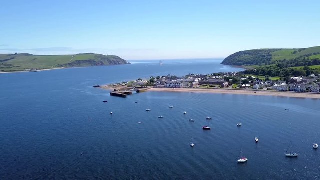 Drone Flying Towards Small Coastal Village