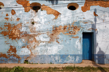 Trinidad, Cuba - July 19, 2018: Typical contrast of vintage house facades at Trinidad, Cuba