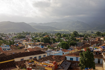 Fototapeta na wymiar Trinidad, Cuba - July 20, 2018: The roofs of the historic center of Trinidad viewed from the tower of Convento San Francis of Assisi in Cuba